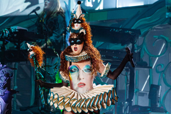 Chappell Roan wears a tutustyle dress with her own face on it as well as mini versions of her head as a headpiece.