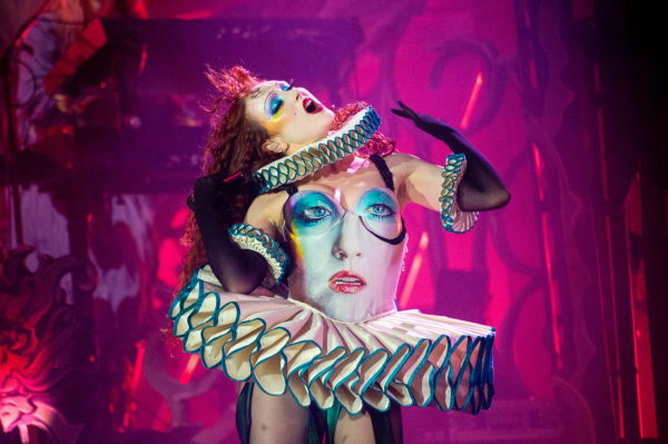 Chappell Roan wears a tutustyle costume with her own face on the bodice. She wears similar makeup to that of the dress.